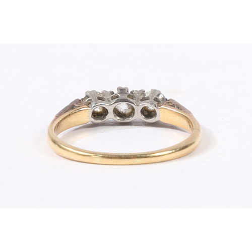 3 - AN 18 CARAT GOLD, PLATINUM AND DIAMOND RING. the head set with three round cut diamonds, flanked by ... 