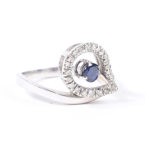 30 - AN 18 CARAT GOLD, SAPPHIRE AND DIAMOND RING. the pierced scrolling diamond set head with central rou... 