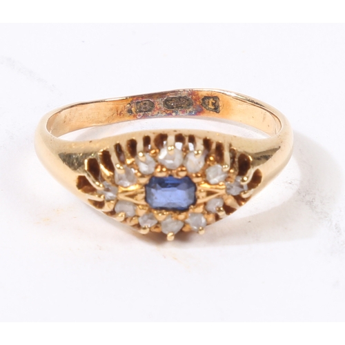 31 - AN 18 CARAT GOLD SAPPHIRE AND DIAMOND RING. the central rectangular facet cut sapphire surrounded by... 