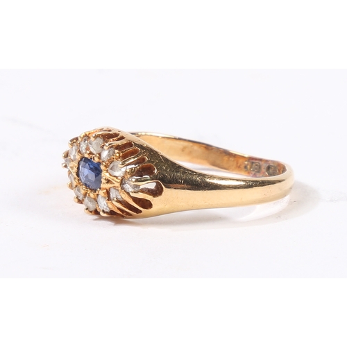 31 - AN 18 CARAT GOLD SAPPHIRE AND DIAMOND RING. the central rectangular facet cut sapphire surrounded by... 