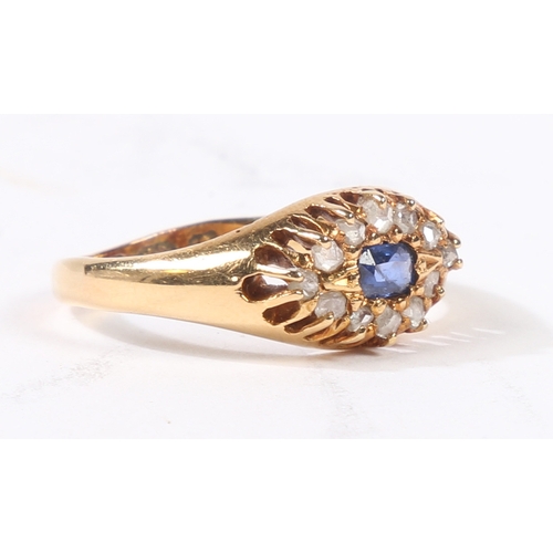 31 - AN 18 CARAT GOLD SAPPHIRE AND DIAMOND RING. the central rectangular facet cut sapphire surrounded by... 