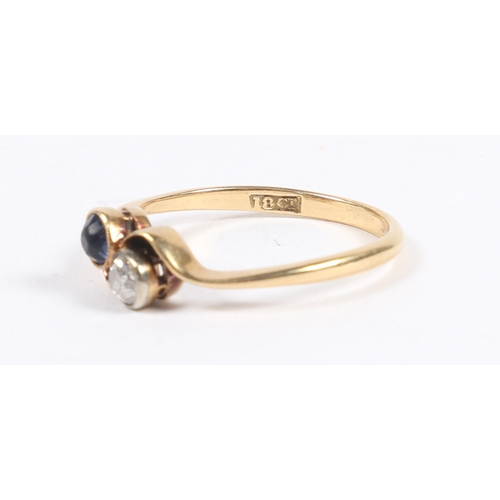 33 - AN 18 CARAT GOLD, SAPPHIRE AND DIAMOND RING. the cross-over head set with a round cut diamond and a ... 