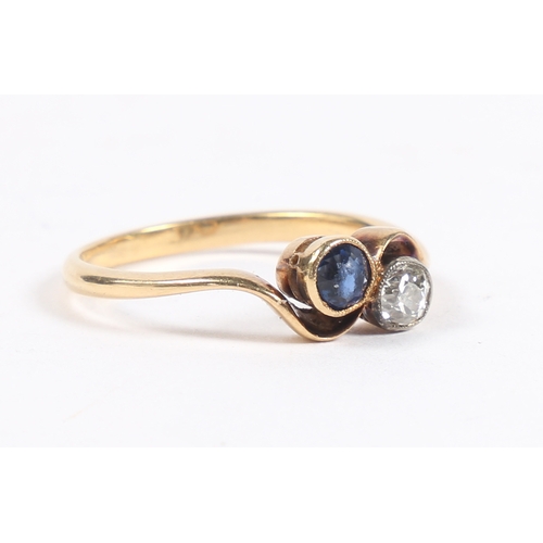 33 - AN 18 CARAT GOLD, SAPPHIRE AND DIAMOND RING. the cross-over head set with a round cut diamond and a ... 