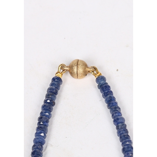 34 - A SAPPHIRE AND STERLING SILVER NECKLACE. formed from facet cut sapphire beads, with silver gilt magn... 