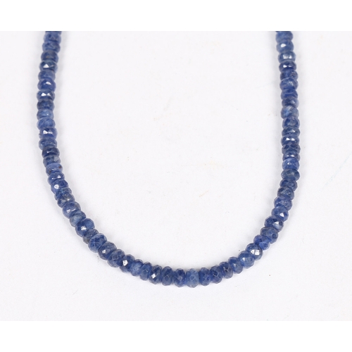 34 - A SAPPHIRE AND STERLING SILVER NECKLACE. formed from facet cut sapphire beads, with silver gilt magn... 