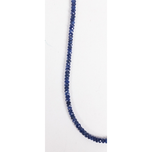 34 - A SAPPHIRE AND STERLING SILVER NECKLACE. formed from facet cut sapphire beads, with silver gilt magn... 