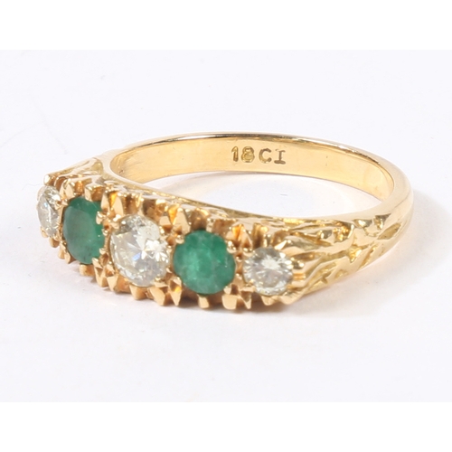 41 - AN 18 CARAT GOLD, EMERALD AND DIAMOND RING. the head set with three round cut diamonds and two round... 