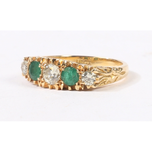 41 - AN 18 CARAT GOLD, EMERALD AND DIAMOND RING. the head set with three round cut diamonds and two round... 