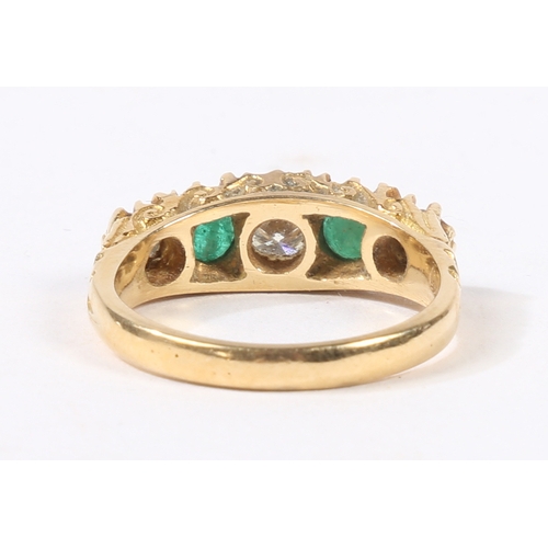 41 - AN 18 CARAT GOLD, EMERALD AND DIAMOND RING. the head set with three round cut diamonds and two round... 