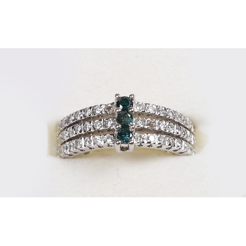 43 - A 14 CARAT WHITE GOLD, EMERALD AND DIAMOND RING. set with three central round cut emeralds flanked b... 