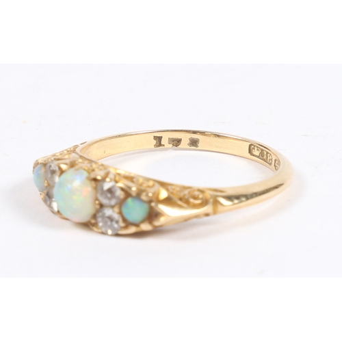 46 - A VICTORIAN 18 CARAT GOLD, OPAL AND DIAMOND RING. the central round cut diamond flanked by four roun... 