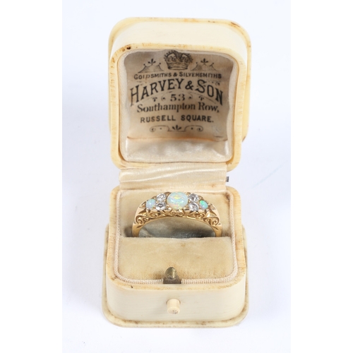 46 - A VICTORIAN 18 CARAT GOLD, OPAL AND DIAMOND RING. the central round cut diamond flanked by four roun... 