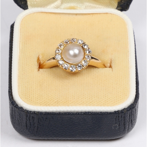 47 - A VICTORIAN 18 CARAT GOLD, PEARL AND DIAMOND RING. the central pearl surrounded by a band of fourtee... 