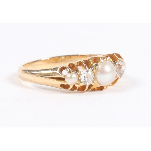 48 - A YELLOW METAL, PEARL AND DIAMOND RING. the pierced shoulders set with a central round pearl flanked... 