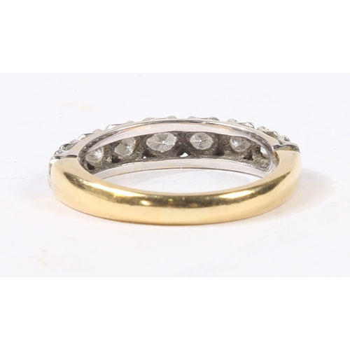 5 - AN 18 CARAT GOLD AND DIAMOND RING. the head set with nine graduated round cut diamonds, ring size L,... 