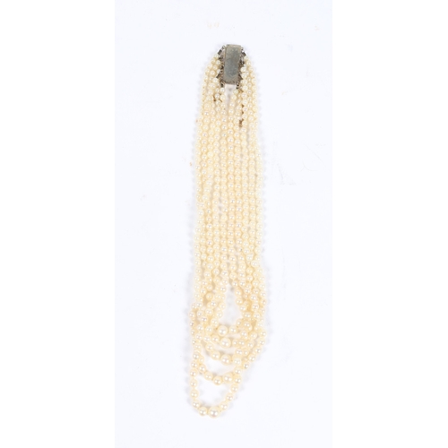 50 - A CULTURED PEARL CHOKER. formed from five strands of graduated cultured pearl beads, the white metal... 