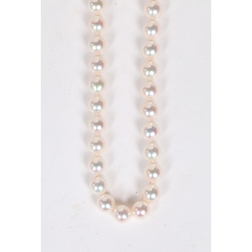 52 - A SINGLE STRAND PEARL NECKLACE. the single strand necklace with 18 carat white gold clasp of orb for... 