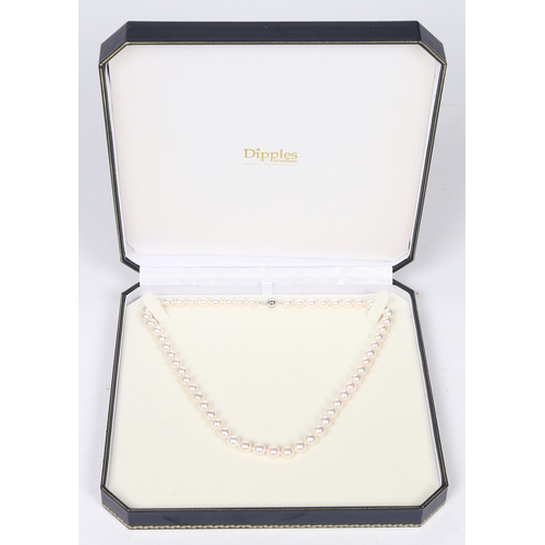 52 - A SINGLE STRAND PEARL NECKLACE. the single strand necklace with 18 carat white gold clasp of orb for... 