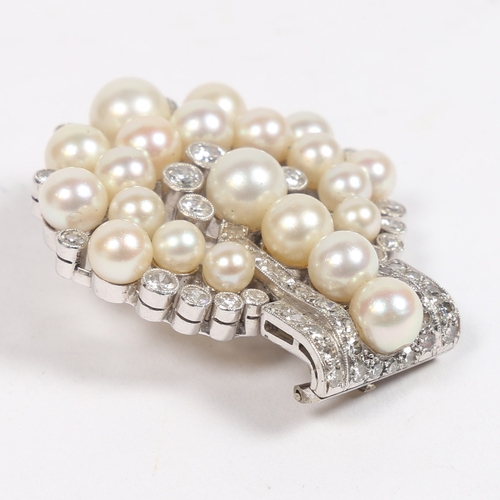 54 - AN ART DECO DIAMOND AND PEARL BROOCH. the four central pearls flanked by round cut diamonds above ar... 