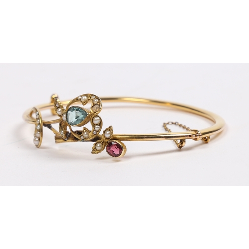 56 - A VICTORIAN 15 CARAT GOLD, AQUAMARINE, GARNET AND PEARL BRACELET. modelled as a fruiting branch with... 