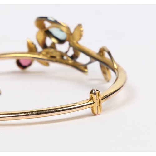 56 - A VICTORIAN 15 CARAT GOLD, AQUAMARINE, GARNET AND PEARL BRACELET. modelled as a fruiting branch with... 