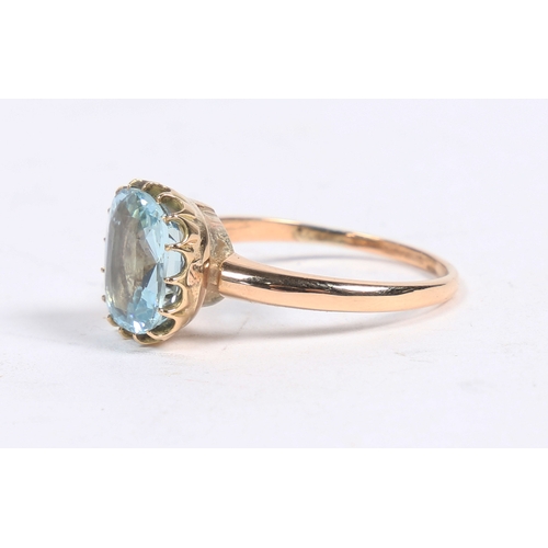 57 - A 9 CARAT GOLD AND AQUAMARINE SOLITAIRE RING. the claw set aquamarine measuring approx. 3ct, ring si... 