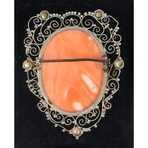 59 - A SILVER GILT CORAL CAMEO BROOCH. the central panel with depiction of a classical lady in profile, s... 