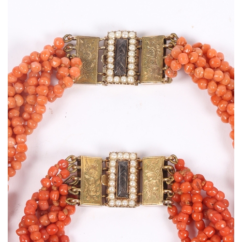 60 - A CORAL BEAD NECKLACE AND BRACELET (2). each formed from six interwoven strands of beads, with 14 ca... 