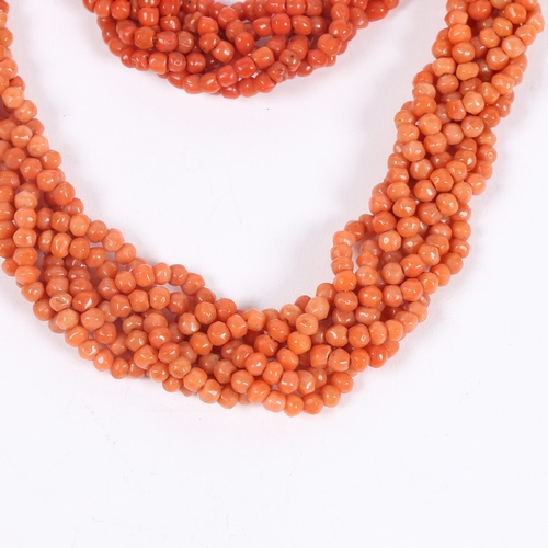 60 - A CORAL BEAD NECKLACE AND BRACELET (2). each formed from six interwoven strands of beads, with 14 ca... 