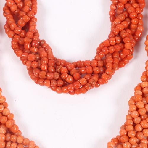 60 - A CORAL BEAD NECKLACE AND BRACELET (2). each formed from six interwoven strands of beads, with 14 ca... 