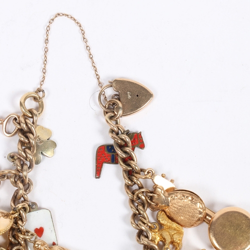 64 - A 9 CARAT GOLD CHARM BRACELET. set with 22 charms including a George V half sovereign 1907, cuckoo c... 