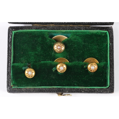 70 - A SET OF FOUR 15 CARAT GOLD AND PEARL DRESS STUDS. the star cur heads set with a central pearl, cons... 