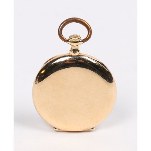 75 - A CARTIER 18 CARAT GOLD LADIES OPEN FACE POCKET WATCH. the signed silver dial with engine turned eff... 