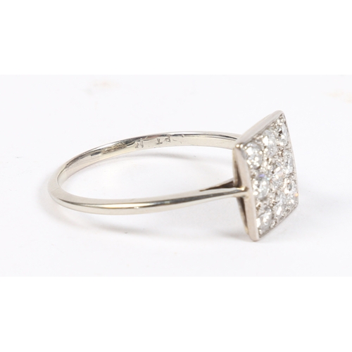 8 - A PLATINUM AND DIAMOND RING. the square head set with nine round cut diamonds, the interior of the b... 