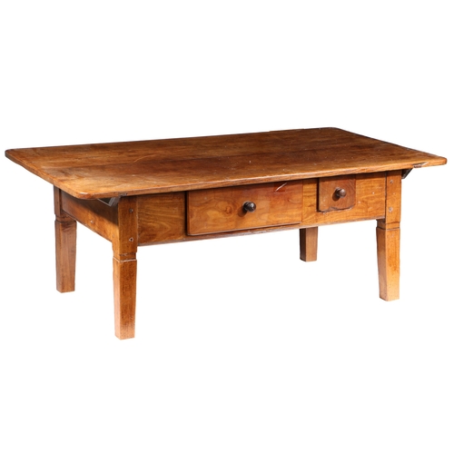 102 - A FRUITWOOD FARMHOUSE TABLE, REDUCED IN HEIGHT TO FORM A COFFEE TABLE, CIRCA 1800. The top of two wi... 