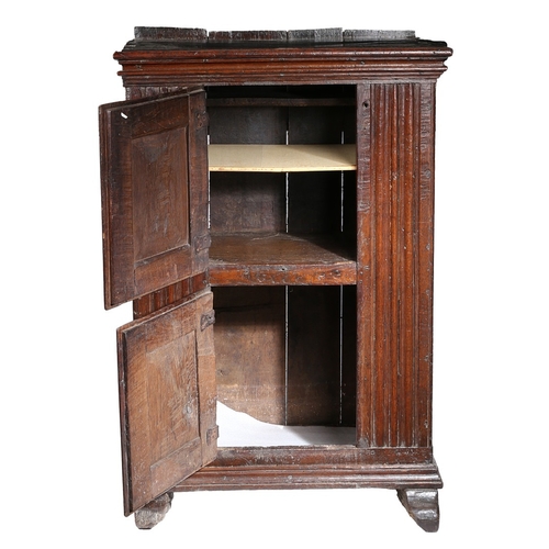 103 - A SMALL 17TH CENTURY OAK LIVERY CUPBOARD, FRANCO-FLEMISH. Of dovetailed boarded construction, with v... 