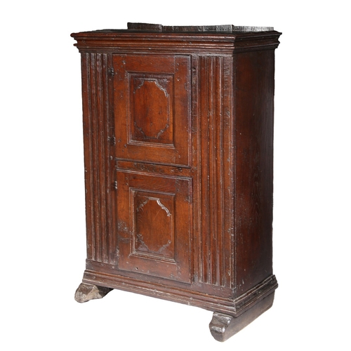 103 - A SMALL 17TH CENTURY OAK LIVERY CUPBOARD, FRANCO-FLEMISH. Of dovetailed boarded construction, with v... 