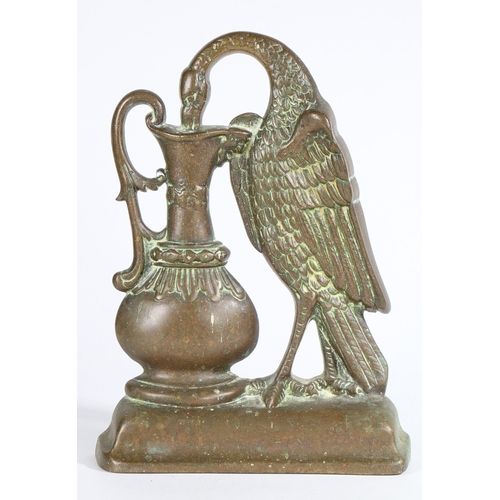 116 - A VICTORIAN CAST BRASS DOOR PORTER. Designed as a bird (pelican?) drinking from a ewer, lead weighte... 