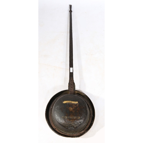 123 - A 17TH CENTURY BRASS AND IRON WARMING PAN. Having a domed pieced and geometric punched-decorated cov... 