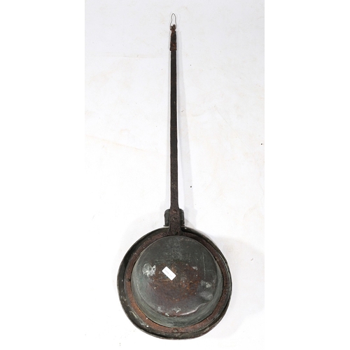 124 - A CHARLES II IRON AND BRASS WARMING PAN, DATED 1665. The circular lid decorated with the inscription... 