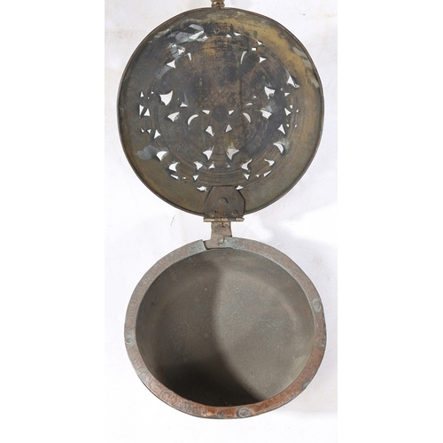 125 - A BRASS, IRON AND COPPER WARMING PAN, DUTCH, CIRCA 1700. The domed circular cover pierced and punch-... 