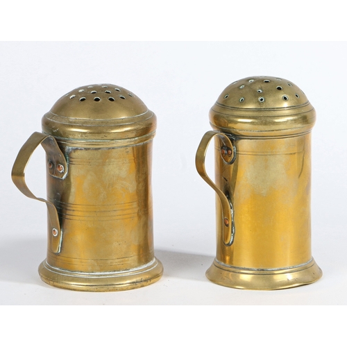 131 - TWO GEORGE III BRASS SHAKERS OR MUFFINEERS, CIRCA 1780. Each of typical straight-sided cylindrical f... 