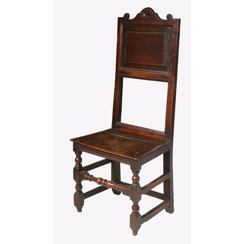 142 - AN UNUSUAL CHARLES II OAK BACKSTOOL, NORTH COUNTRY, CIRCA 1680. The tall and slender back with field... 