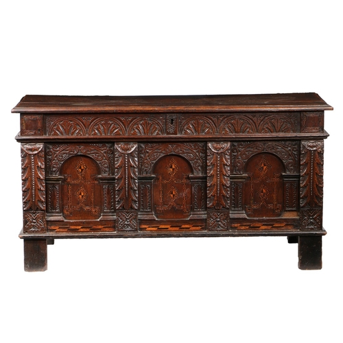 145 - A JAMES I OAK AND PARQUETRY INLAID COFFER, WEST COUNTRY, CIRCA 1610. Having a boarded top, and leafy... 