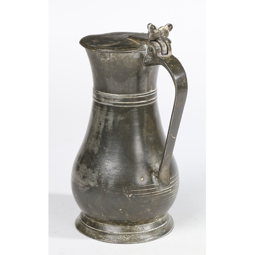 148 - A GEORGE III PEWTER PINT GUERNSEY MEASURE, SOUTHAMPTON, CIRCA 1760. With typical heart-shaped lid, t... 