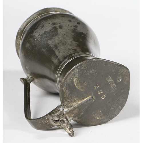 148 - A GEORGE III PEWTER PINT GUERNSEY MEASURE, SOUTHAMPTON, CIRCA 1760. With typical heart-shaped lid, t... 