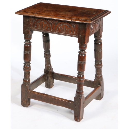 15 - A CHARLES I OAK JOINT STOOL, CIRCA 1640. Having a double-reeded top, and leafy-lunette carved rails,... 