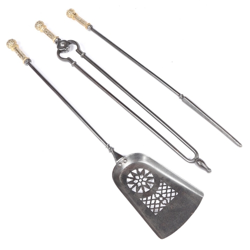 151 - A SET OF THREE PATINATED BRASS AND STEEL FIRE TOOLS, (3). To include a shovel, with pierced blade, t... 