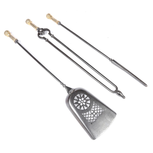 151 - A SET OF THREE PATINATED BRASS AND STEEL FIRE TOOLS, (3). To include a shovel, with pierced blade, t... 