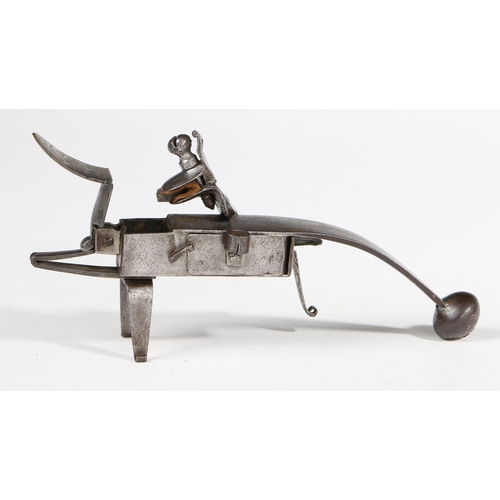 171 - AN IRON TINDER PISTOL OR TABLE STRIKE-A-LIGHT. The 'butt' with a ball end, the lockplate fitted to t... 